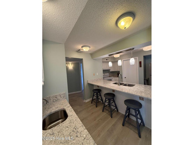 Step into relaxed coastal living with this freshly updated and