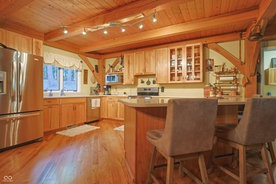 Custom red oak timber-frame home with Lake Monroe views, located - photo 4