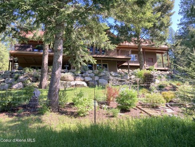 Custom-built home on 13.59 private, treed acres in the highly - photo 1