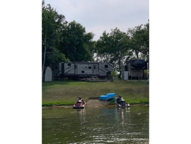 This lake lot has .355 acres with 91 feet of shoreline and a - photo 2