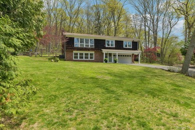 Set on a full acre and surrounded by mature trees and lush - photo 1