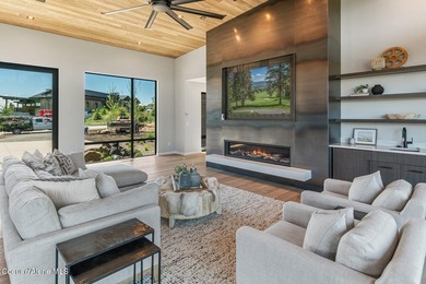Set against a serene stand of forest, this spacious residence - photo 3