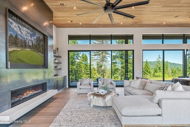 Set against a serene stand of forest, this spacious residence - photo 4