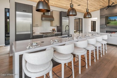 Set against a serene stand of forest, this spacious residence - photo 6