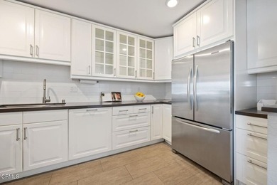 Welcome home to this 1-story top floor end unit that has been