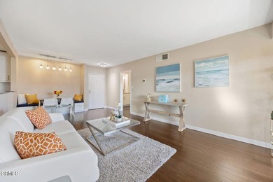 Welcome home to this 1-story top floor end unit that has been