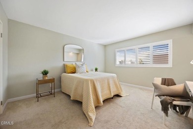 Welcome home to this 1-story top floor end unit that has been