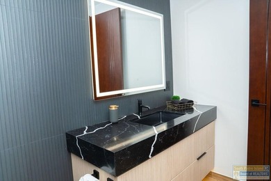 Come view this exquisite channel-front coastal home. With its - photo 16
