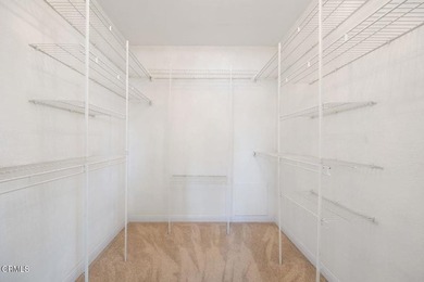 Welcome home to this 1-story top floor end unit that has been