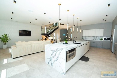 Come view this exquisite channel-front coastal home. With its - photo 26