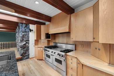 Tucked away behind a private tree-lined drive in one of - photo 13