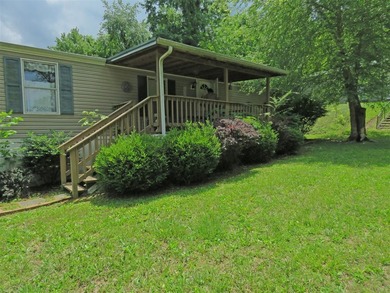 Step into a world of lakeside serenity with this stunning - photo 3