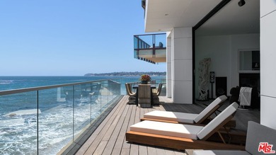 Set within the prestigious, guard-gated enclave of Malibu Cove - photo 3