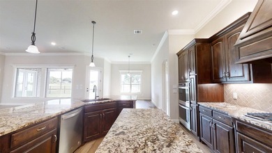 Situated along the golf course in Harbor Lakes, this very - photo 9