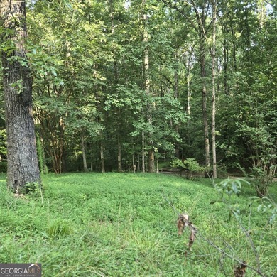 Nestled on a serene three-acre lot, this charming three-bedroom - photo 14