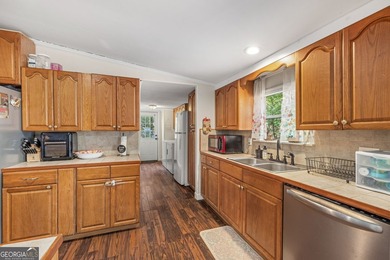 Nestled on a serene three-acre lot, this charming three-bedroom - photo 16