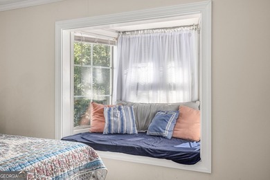 Nestled on a serene three-acre lot, this charming three-bedroom - photo 18