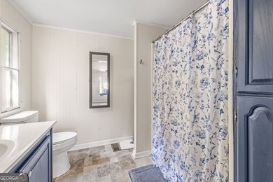 Nestled on a serene three-acre lot, this charming three-bedroom - photo 20