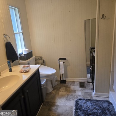 Nestled on a serene three-acre lot, this charming three-bedroom - photo 21
