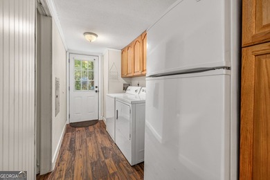 Nestled on a serene three-acre lot, this charming three-bedroom - photo 24