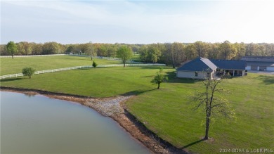 Be amazed by this 4,600 sf home, nestled in a serene setting w/ - Lake Home For Sale in Barnett, Missouri
