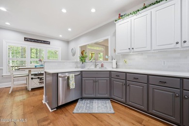 Nestled on a beautifully landscaped homesite in the sought-after - photo 22