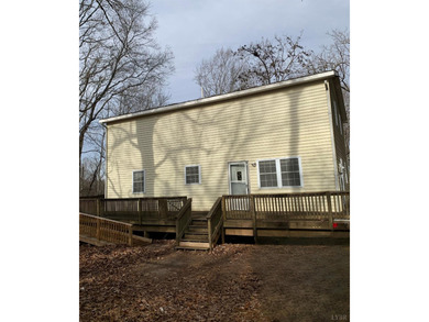 Nestled on 17.9 +/- acres with expansive road frontage, this