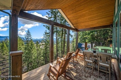 Tucked into the trees in one of Sandpoint's most sought-after - photo 2