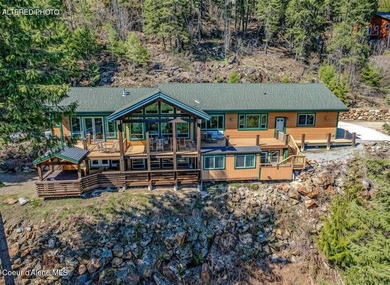 Tucked into the trees in one of Sandpoint's most sought-after - photo 3