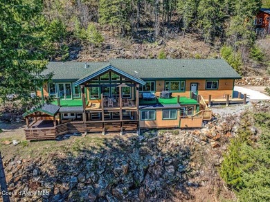 Tucked into the trees in one of Sandpoint's most sought-after - photo 4