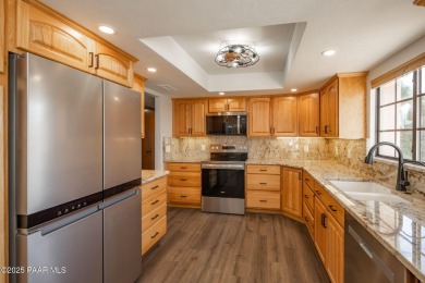 This beautifully remodeled 2-story brick and stucco home blends