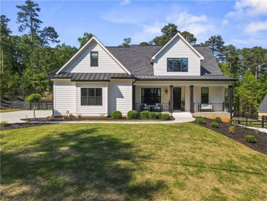 Lake Home For Sale in Flowery Branch, Georgia