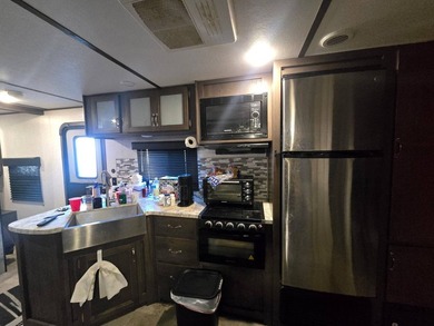 Motivated Seller! Charming 2-bedroom, 1-bath camper with a large - photo 10