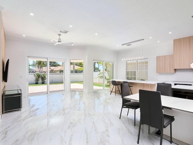 This completely reimagined 3-bedroom, 2-bath residence offers a - photo 5