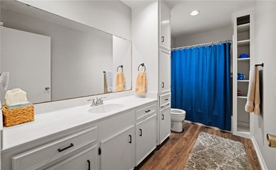 This 3-bed, 2-bath brick home sits on a large corner lot in an - photo 16