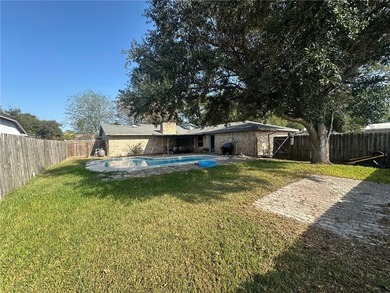 This 3-bed, 2-bath brick home sits on a large corner lot in an - photo 19