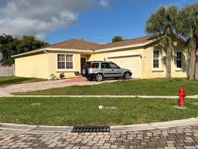 This delightful one-story home sits on a desirable corner lot in - photo 1