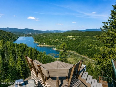 Set on 9.81 private acres with rare dual lake views of Fernan - photo 1