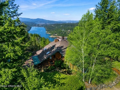 Set on 9.81 private acres with rare dual lake views of Fernan - photo 2