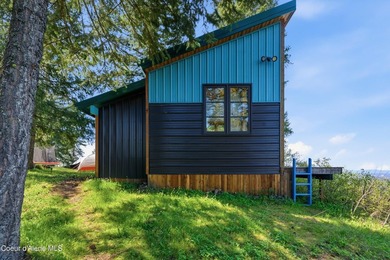Set on 9.81 private acres with rare dual lake views of Fernan - photo 9