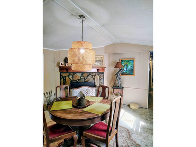 This charming 4-bedroom, 2-bath mobile home presents a fantastic - photo 13