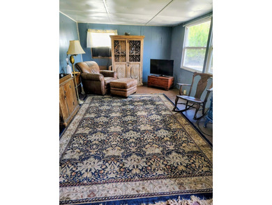 This charming 4-bedroom, 2-bath mobile home presents a fantastic - photo 14