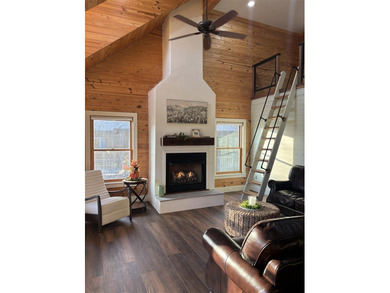 Beautiful cabin style lake front home with year round water! - photo 7