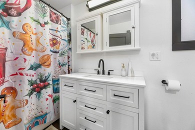 This updated contemporary city home features a convenient floor - photo 12