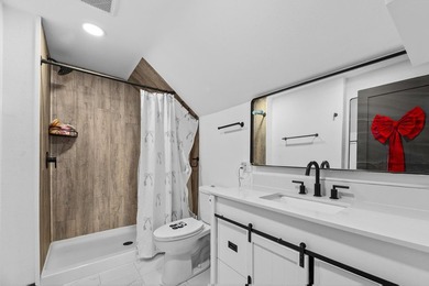 This updated contemporary city home features a convenient floor - photo 17