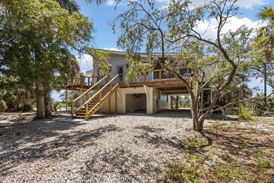 Tucked away on a private waterfront peninsula in historic Cedar - photo 25
