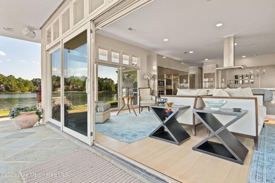 This 5BR Trillium estate redefines lake living. Over 850 ft of - photo 30