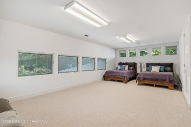 This 5BR Trillium estate redefines lake living. Over 850 ft of - photo 56