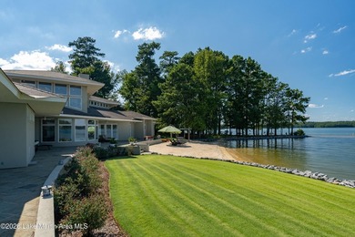 This 5BR Trillium estate redefines lake living. Over 850 ft of - photo 57