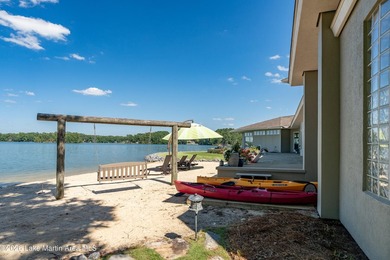 This 5BR Trillium estate redefines lake living. Over 850 ft of - photo 58